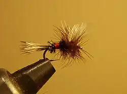 Fish hook with feathers and hair