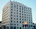 Built in 1928 as the Royal Edward Hotel, the eight-storey Royal Edward Arms is the oldest "highrise" in Fort William and was designed by Dorr & Dorr architects of Minneapolis.[37] The upper reaches of the building is decorated with an Art Deco stylization of Gothic ornamentation.[38] Today the building is used for low income housing,[39] but during its heyday hosted many famous individuals, including Her Majesty Queen Elizabeth II.[40]