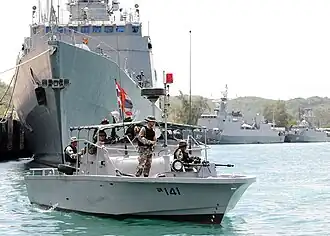 A Royal Thai Navy (RTN) riverine patrol boat. Naresuan, Pattani and Khamronsin are moored in the background.