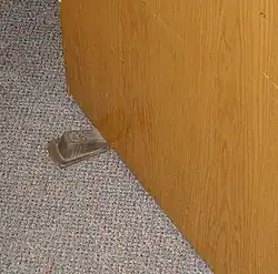 A commercially available rubber doorstop