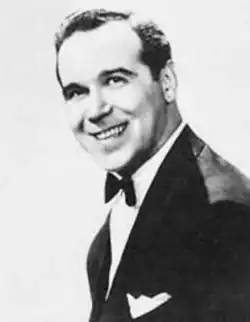 Black-and-white portrait of American bandleader Russ Morgan in a suit and tie.