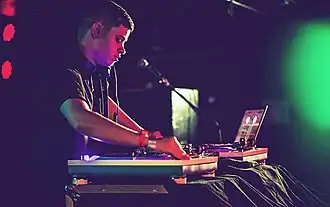 Rustie performing