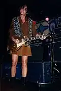 Guitarist Ruthie Morris of Magnapop wearing a leopard print vest on stage