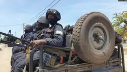 Rwanda Security Forces sitting in a car on patrol