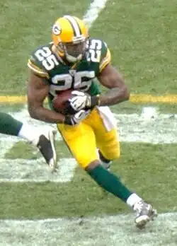 Grant in uniform rushing the ball during a game