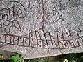 Detail showing text written outside of the serpent.