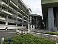 Approach to entrance B of the station, with the multi-storey park and ride building at left