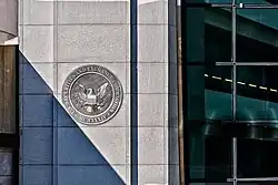 Front façade of the U.S. Securities and Exchange Commission headquarters with the SEC seal.