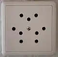 Type 12 triple socket (10 A), now obsolete and no longer sold or installed