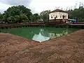 Safa Masjid adjacent to which, on the south, is a masonry tank measuring 30 by 30&nbsp;m (98 by 98&nbsp;ft), with Mihrab designs