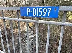 Sign on Bridge reinforced concrete girder bridge panel P-01597 (1951),[6] chemin des Moulins