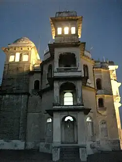 Monsoon palace at evening with interior lights on