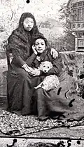 Two Coast Salish women with a dog suspected to be a mixed woolly dog. (Chilliwack Museum and Archives), before 1900