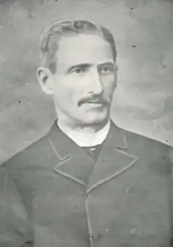 A black-and-white portrait photograph of Francisco Menéndez