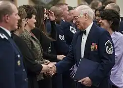 On Feb. 22, 2013, CMSAF Sam Parish congratulates Civilian Supervisor of the Year Category 2 Award Winner Annette Terry at Malmstron Air Force Base.