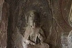 Late Nanzhao (738-902) to early Dali period (937-1253) stone carving of Puxian as part of a triad together with the Buddha Piluzhena and the Bodhisattva Wenshu at the Shizhongshan Grottes in Dali Bai, Yunnan, China.
