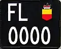 Genuine Liechtenstein motorcycle registration plate with the invalid number 0000.