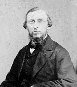 Nineteenth century black-and-white photograph of Samuel Merrill Woodbridge, a man in suit, dress shirt, and tie