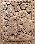 Man in costume from the northwest, fighting against lions.[13]