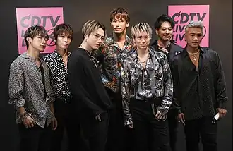 From left to right: NAOTO, Takanori Iwata, Hiroomi Tosaka, Naoki Kobayashi, Ryuji Imaichi, Kenjiro Yamashita, ELLY.
