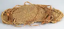 A color picture of a braided sandal