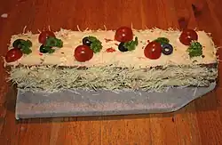 Elongated smörgåstårta with dark bread