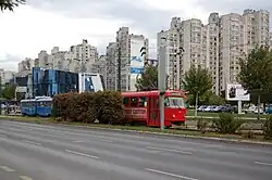 Tram 215 running westbound past Alipašino Polje on Line 3 (20 October 2011)