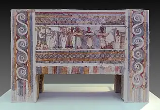 The Hagia Triada sarcophagus; 1370-1315 BC; limestone; length: 1.4 m, height: 0.9 m; from Chamber Tomb 4 at Hagia Triada, near Phaistos (Crete); Heraklion Archaeological Museum[13]