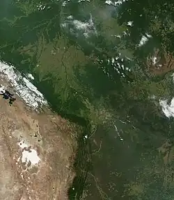 A portion of the Andes mountains from space, showing the contrast between the dry terrain west of the mountain ridge and wet terrain to the east