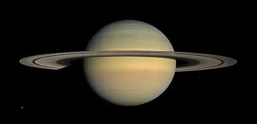 Image 23 Cassini–Huygens Photograph credit: NASA / JPL / Space Science Institute The Cassini–Huygens space-research project involved a collaboration between NASA, the European Space Agency, and the Italian Space Agency to send a probe to study the planet Saturn and its system, including its rings and its natural satellites. This natural-color mosaic image, combining thirty photographs, was taken by the Cassini orbiter over the course of approximately two hours on 23 July 2008 as it panned its wide-angle camera across Saturn and its ring system as the planet approached equinox. Six moons are pictured in the panorama, with the largest, Titan, visible at the bottom left. More selected pictures