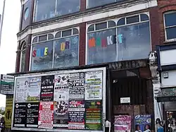 Wards Corner decorated with campaign posters