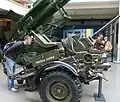 Same gun, with a man nearby for a reference of scale. Markings "Fuerza Aérea Argentina" (English: Argentine Air Force) on the side.