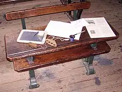 Historic items and information sheets on a desk.