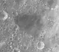 The low-albedo, flat-floored crater Schubert F