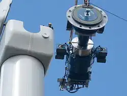 Image 41Components of a horizontal-axis wind turbine (gearbox, rotor shaft and brake assembly) being lifted into position (from Wind turbine)