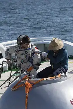ESA astronaut Samantha Cristoforetti on the Shenzhou training capsule