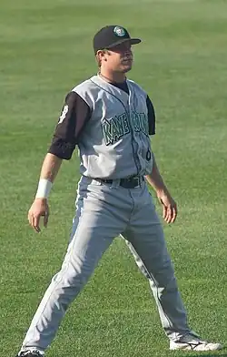 Sean Doolittle, clean shaven, standing on a grass field in a gray Kane County Cougars uniform