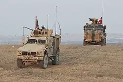 U.S. and Turkish forces conduct joint patrols on the outskirts of Manbij, Syria, November 8, 2018