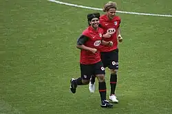 Teammates Sergio Agüero and Diego Forlán training at the Emirates Stadium side by side.