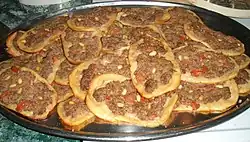 Sfiha, a flatbread with a minced meat topping, often lamb