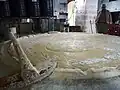 The cooking of ingredients is done by Al Tabbeekha or the cooks.[17] Photo at the Shaka'a factory.