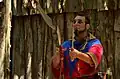 Costumed performer juggling swords