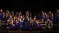 A show choir competing on stage in 2017.