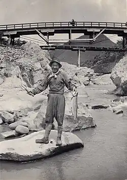 A fisherman wearing tabi with sewn-on woven-straw soles, 1915