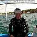 Technical diver with sidemount helmet, pre-dive.