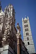 Façade, bell tower, and column with Romulus and Remus