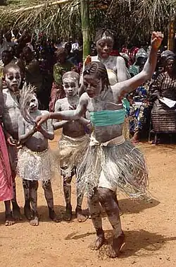Students celebrate with traditional dancing in Koindu, Kailahun District, Sierra Leone