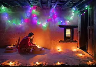 Image 22Woman lighting a diyo during Tihar, by Mithun Kunwar (edited by Radomianin) (from Wikipedia:Featured pictures/Culture, entertainment, and lifestyle/Religion and mythology)