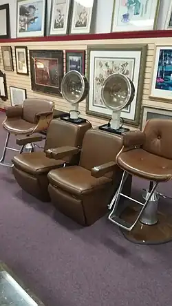 Brown hood dryers, with ash trays in the arm rest