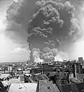 Smoke rising from the Apollo refinery, June 16, 1944